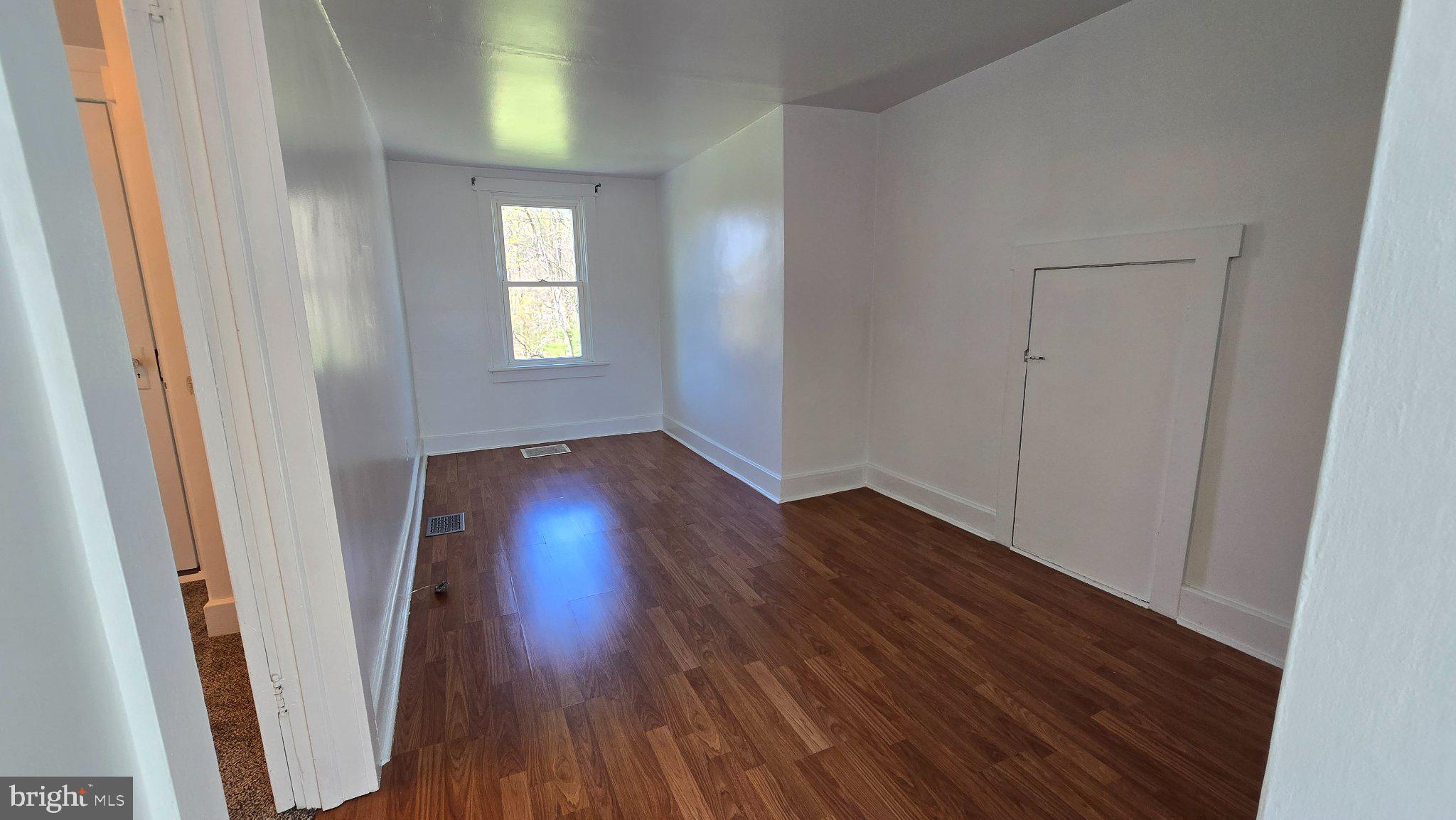 1233 New London Road Landenberg, PA 19350 - Photo 15 of 37 an empty room with wooden floor and windows