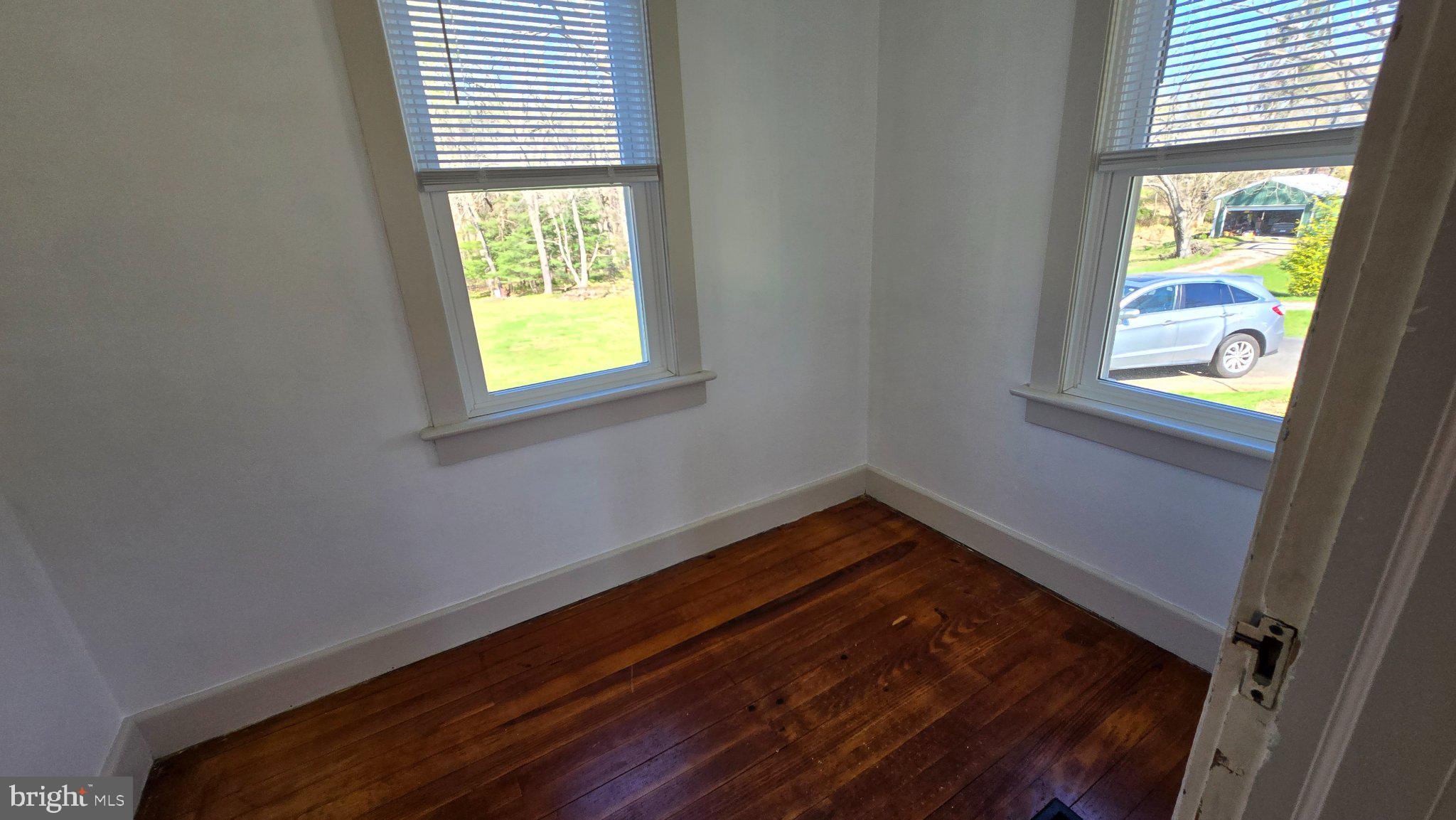 1233 New London Road Landenberg, PA 19350 - Photo 6 of 37 a view of an empty room with a window
