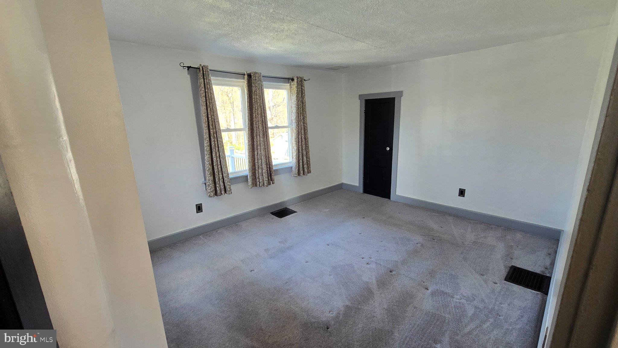 1233 New London Road Landenberg, PA 19350 - Photo 10 of 37 a view of a livingroom with an empty space and window