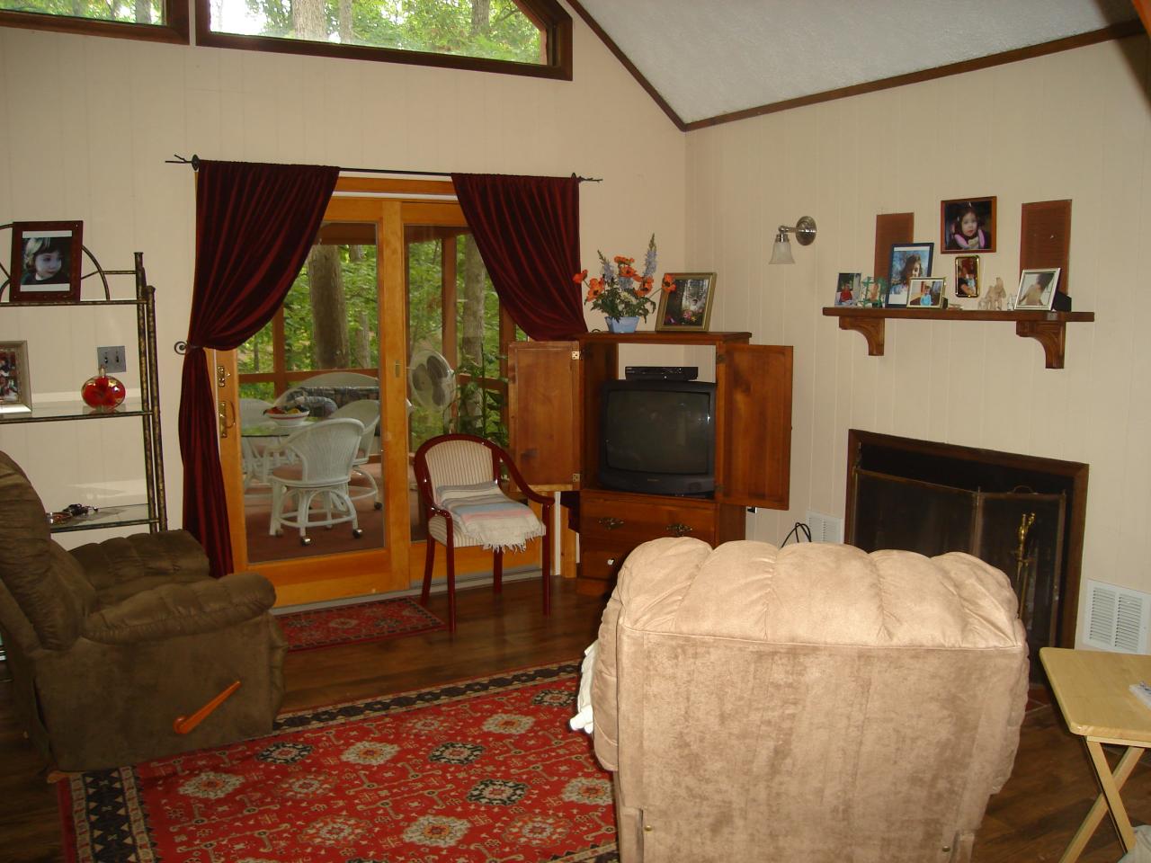 967 Decker Road Bushkill, PA 18324 - Photo 3 of 12 a living room with furniture a fireplace and a flat screen tv