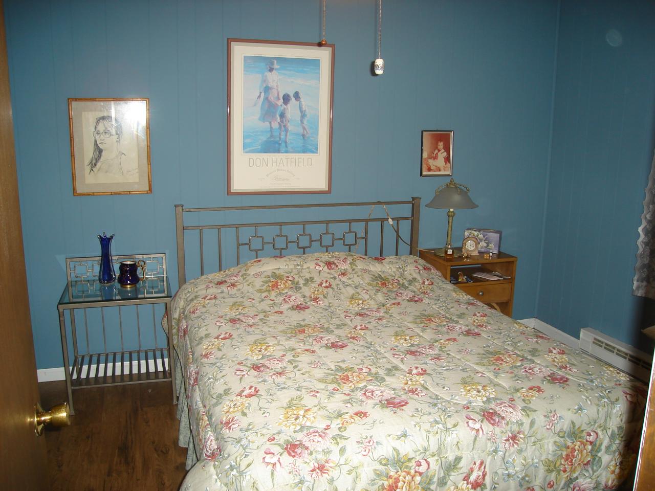 967 Decker Road Bushkill, PA 18324 - Photo 6 of 12 a bedroom with a bed and a lamp on dresser