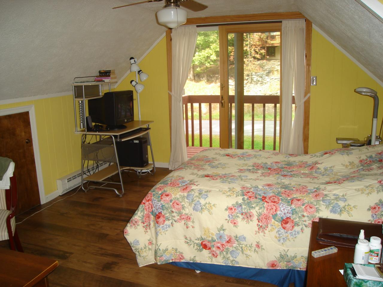 967 Decker Road Bushkill, PA 18324 - Photo 9 of 12 a bedroom with a bed and wooden floor