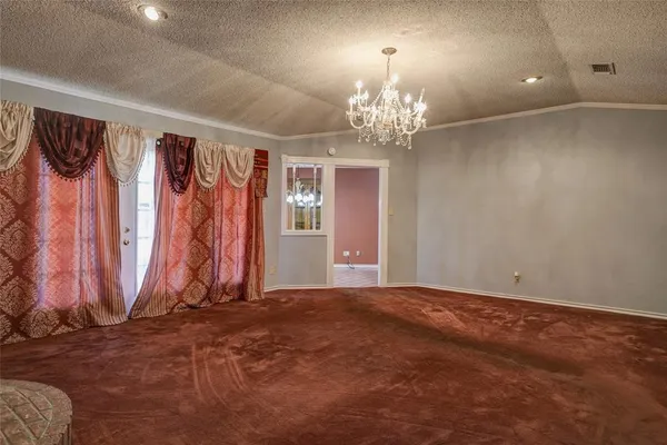a view of a room with lots of windows and chandelier