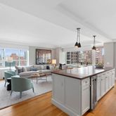a kitchen with counter top space appliances and windows