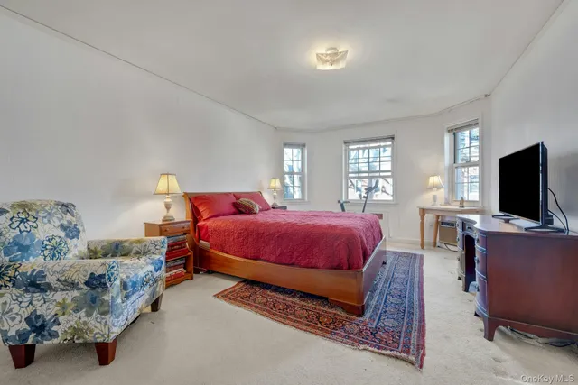 a bedroom with a large bed and a furniture