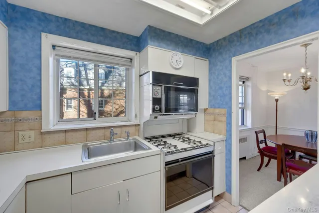 a kitchen with a stove and a sink