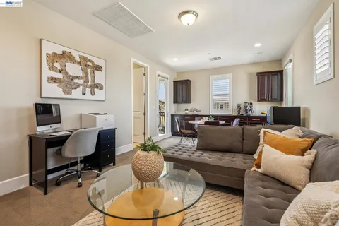 a view of a chair and tables in the backyard