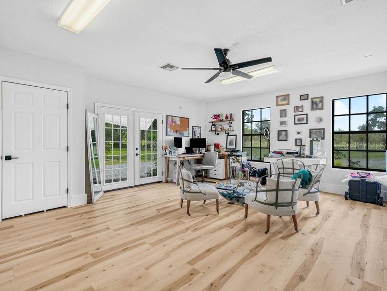 1850 South Lake Reedy Boulevard Frostproof, FL 33843 - Photo 11 of 36 a living room with furniture and a large window