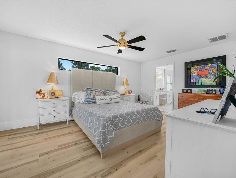 1850 South Lake Reedy Boulevard Frostproof, FL 33843 - Photo 14 of 36 a bedroom with a bed and a flat screen tv