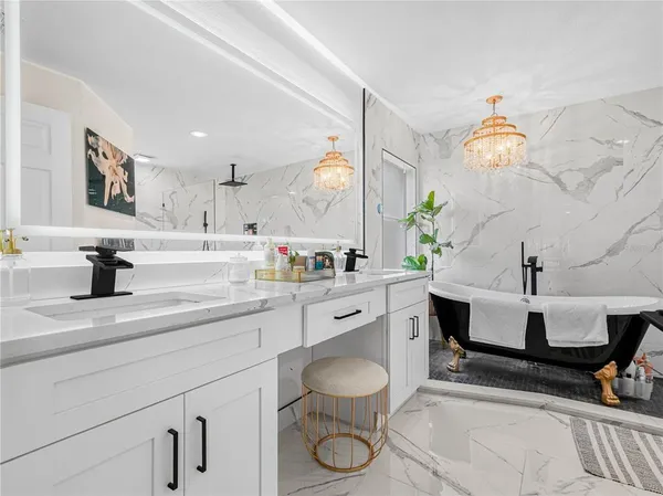 a spacious bathroom with a sink a toilet and a mirror