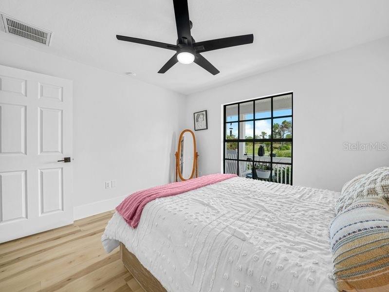 1850 South Lake Reedy Boulevard Frostproof, FL 33843 - Photo 21 of 36 a bedroom with a large bed and a window