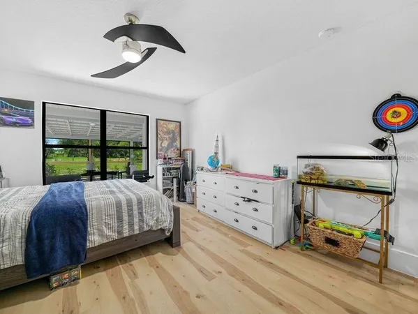 a bedroom with a bed and a table