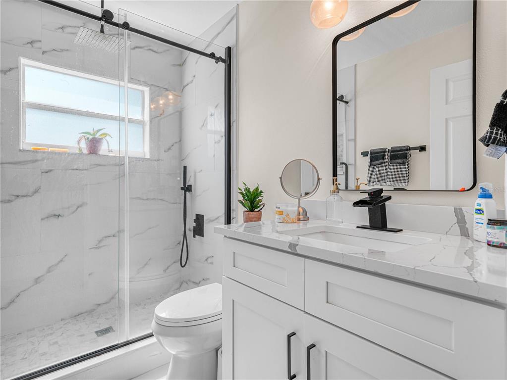 1850 South Lake Reedy Boulevard Frostproof, FL 33843 - Photo 24 of 36 a bathroom with a sink toilet and shower