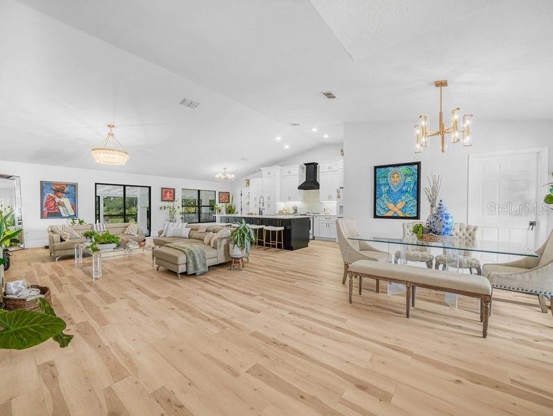1850 South Lake Reedy Boulevard Frostproof, FL 33843 - Photo 3 of 36 a living room with furniture and a wooden floor