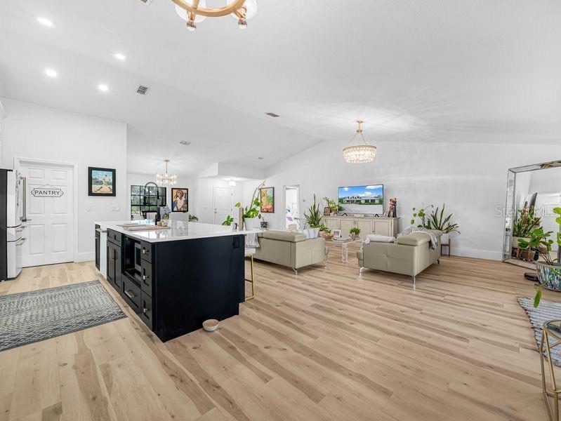 1850 South Lake Reedy Boulevard Frostproof, FL 33843 - Photo 6 of 36 a living room with furniture and a kitchen view