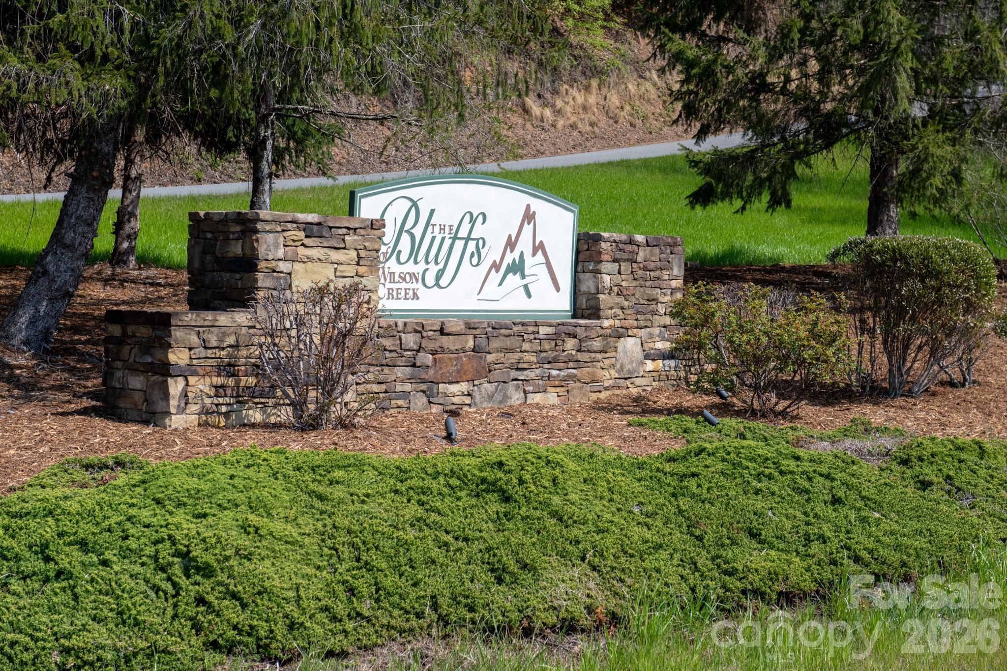 Tbd Tbd Ritter Ridge Lane, Unit 27 Hudson, NC 28638 - Photo 18 of 43 a view of a sign board with a yard