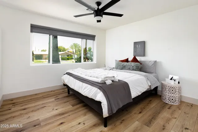 a bedroom with a bed and window