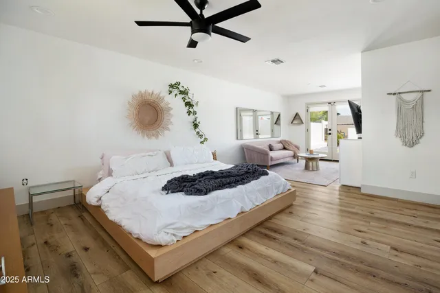 a bedroom with a bed and window