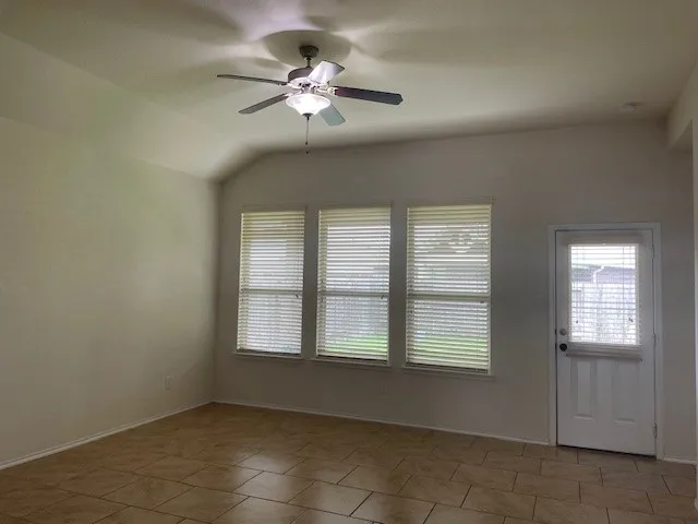 a bathroom with a bathtub sink and mirror