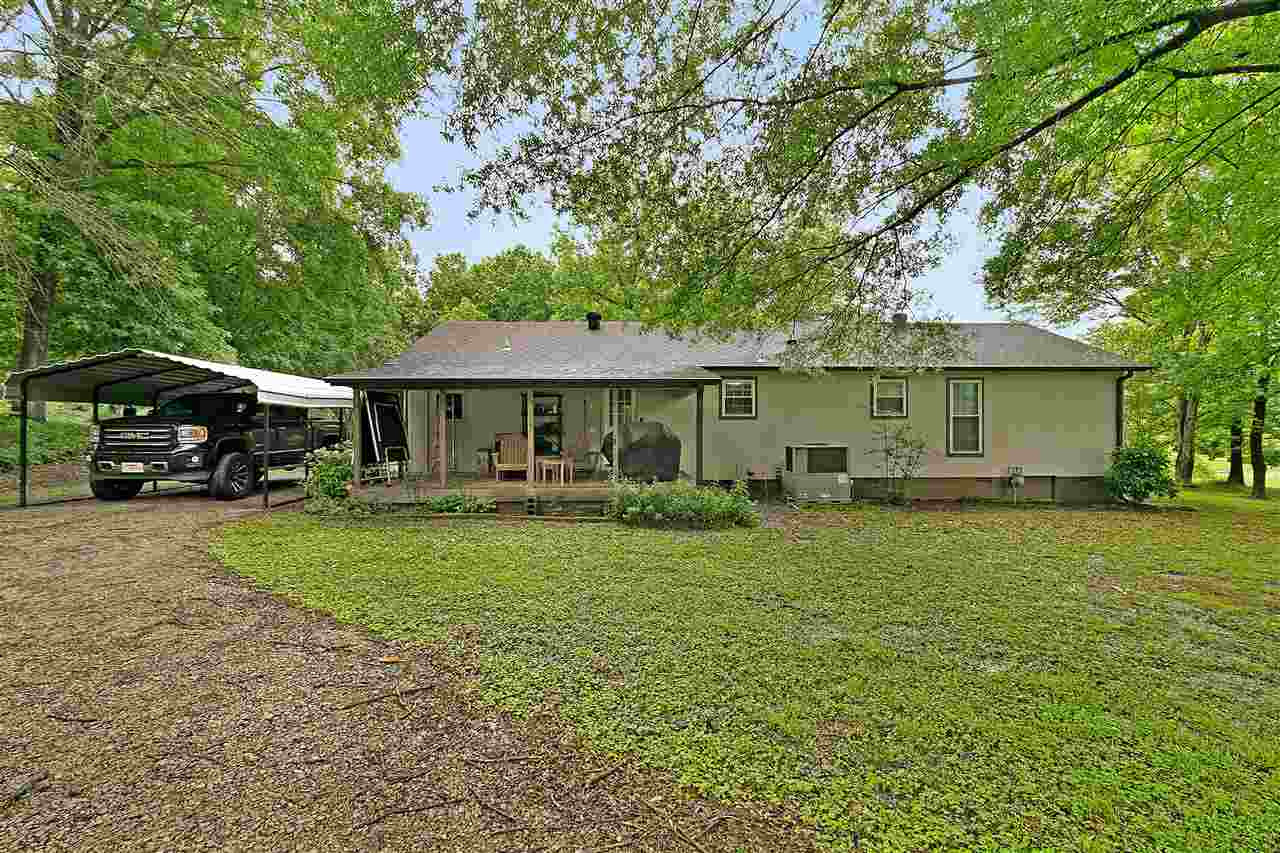 58 John Brown Road Beech Bluff, TN 38313 - Photo 18 of 18 a front view of a house with a garden