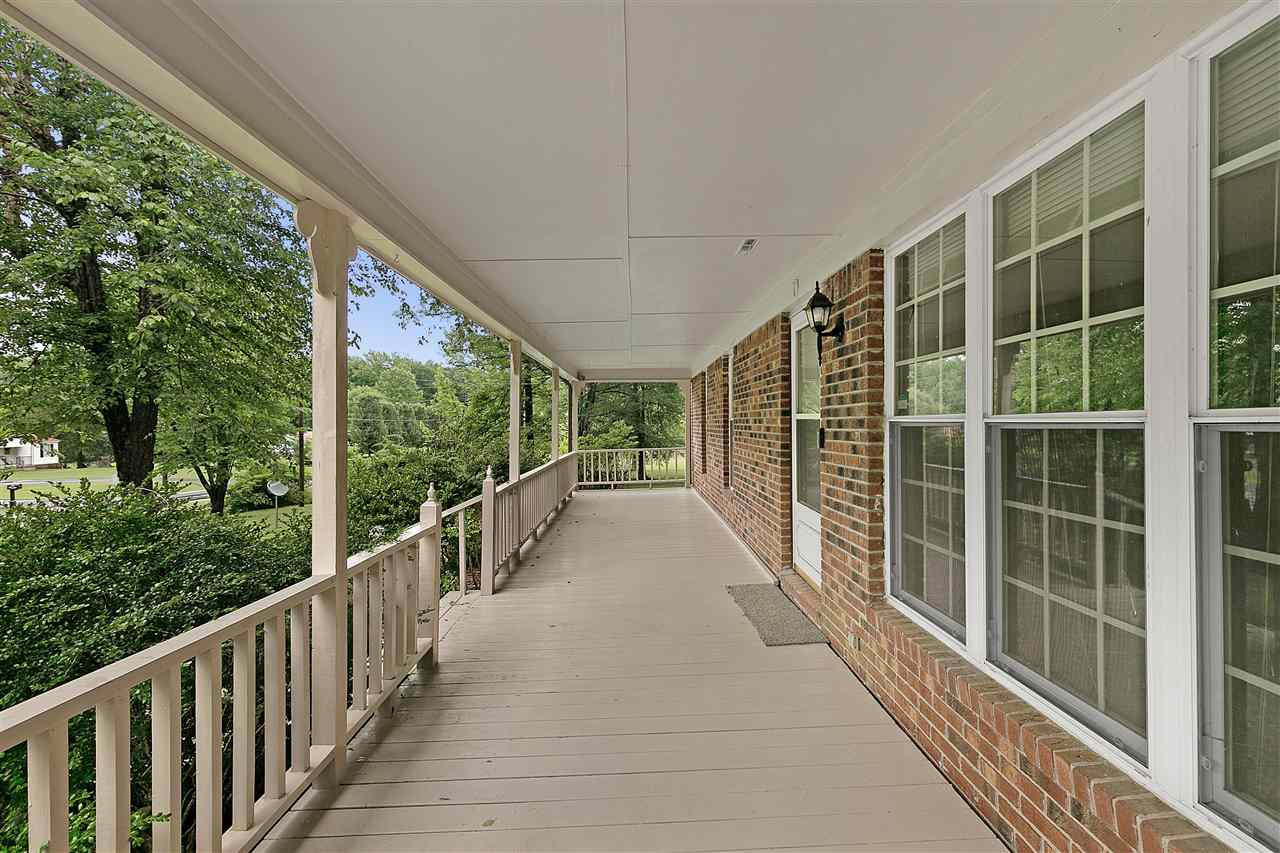 58 John Brown Road Beech Bluff, TN 38313 - Photo 3 of 18 a view of balcony with floor to ceiling window and wooden fence
