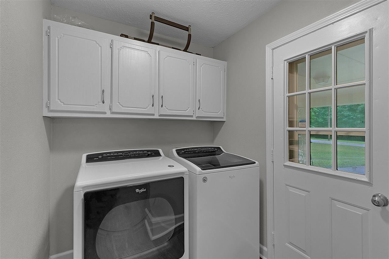 58 John Brown Road Beech Bluff, TN 38313 - Photo 9 of 18 a utility room with dryer and washer