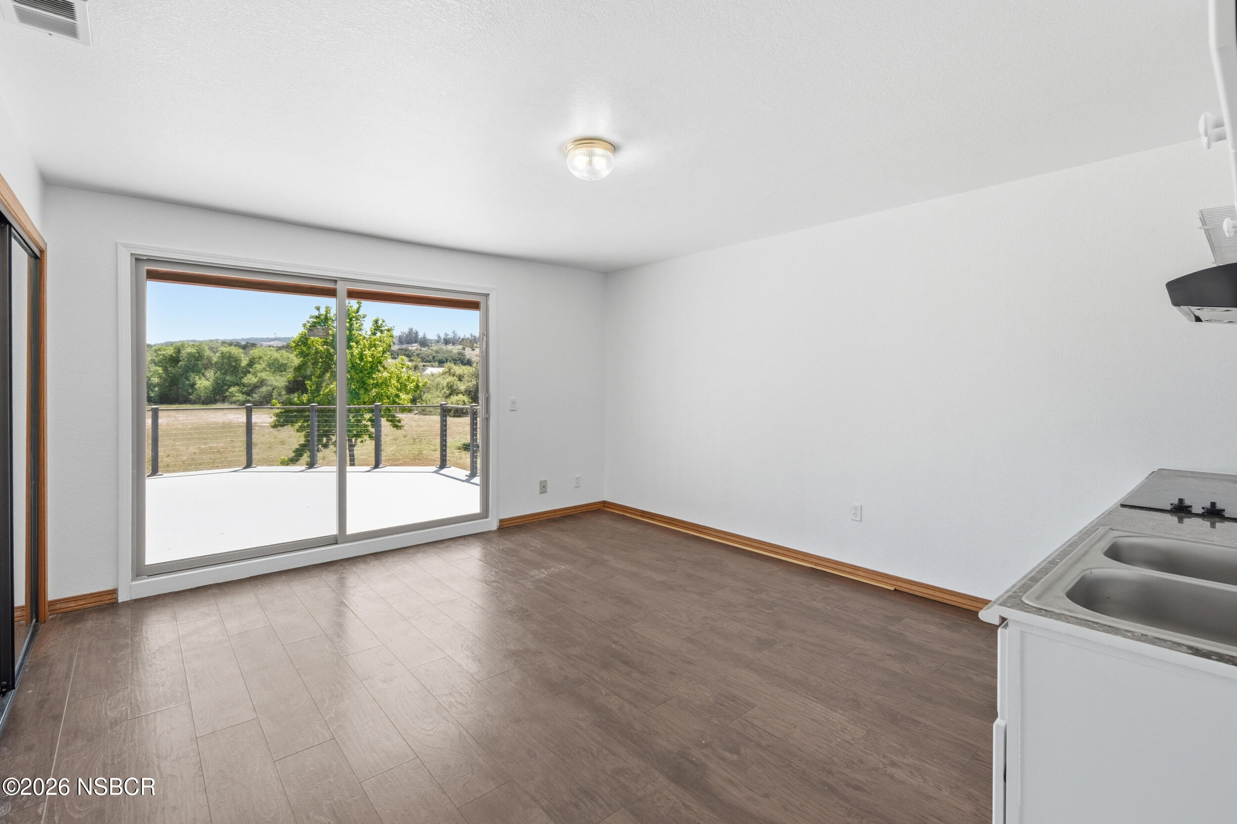 140 East Rice Ranch Road Santa Maria, CA 93455 - Photo 24 of 44 a view of a room with wooden floor and window