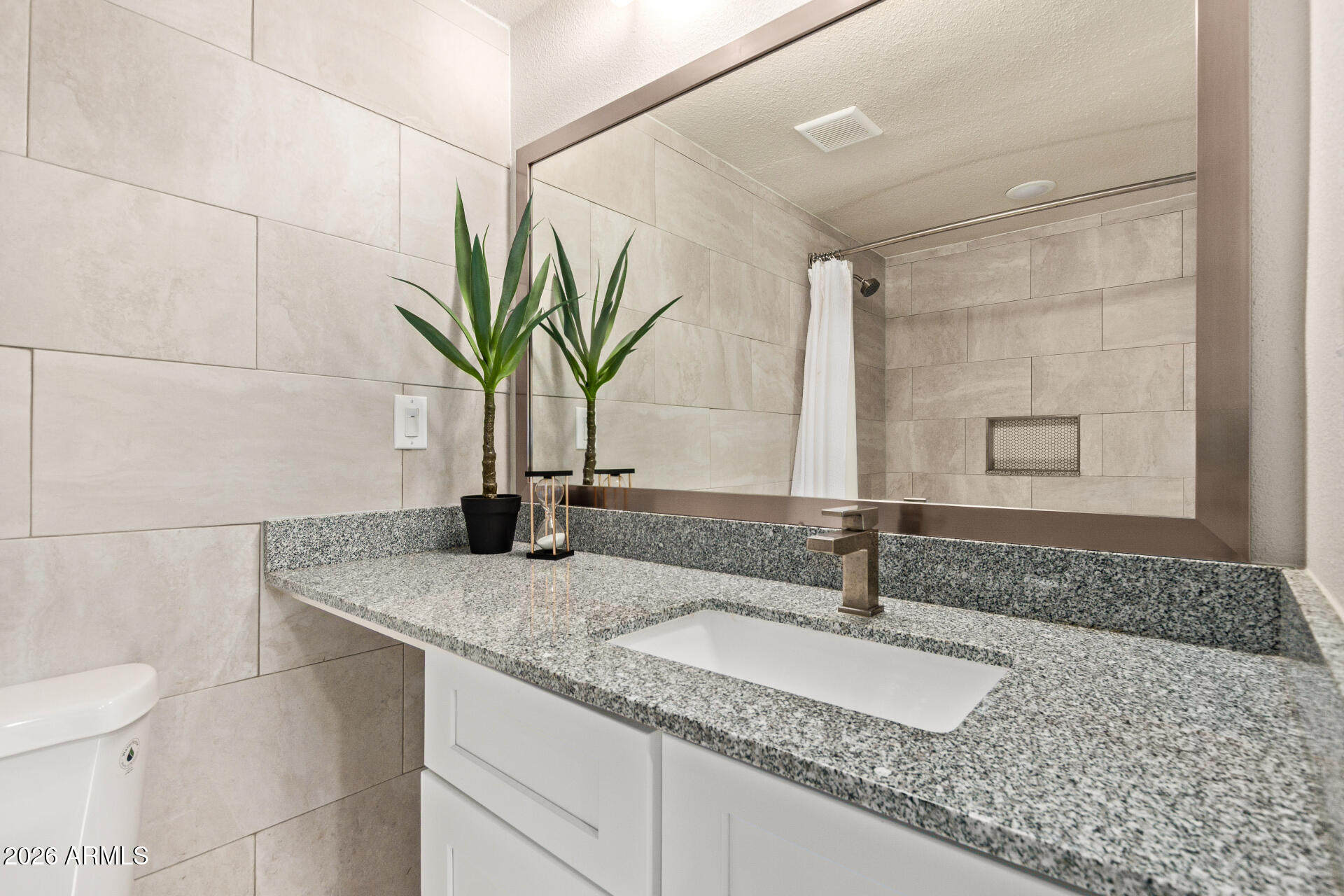400 West Baseline Road, Unit 312 Tempe, AZ 85283 - Photo 14 of 32 a bathroom with a sink and a mirror