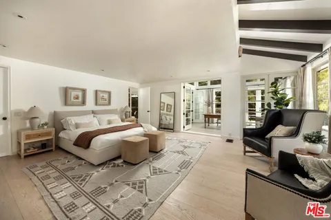 a bedroom with a bed and a stove