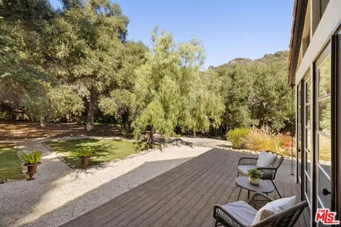 a patio with water table and chairs