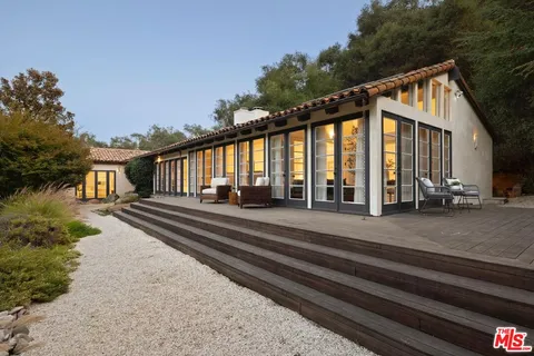 a house view with a garden space