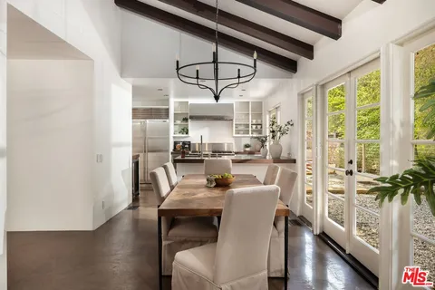 a dining room with furniture window wooden floor