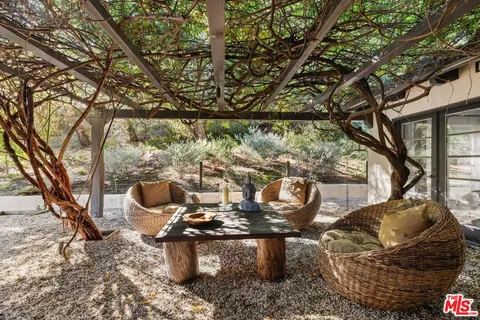 a view of outdoor sitting area with furniture