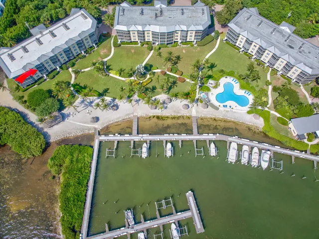 a view of a swimming pool with a table and chairs