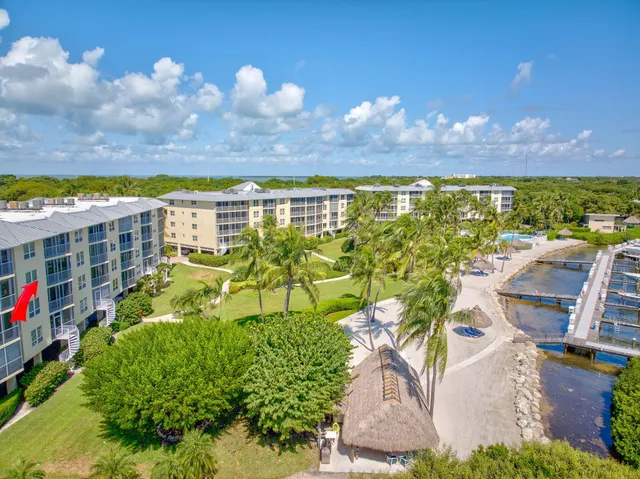 an aerial view of houses with yard