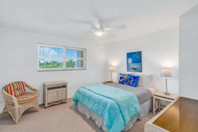 a dining room with furniture and chandelier