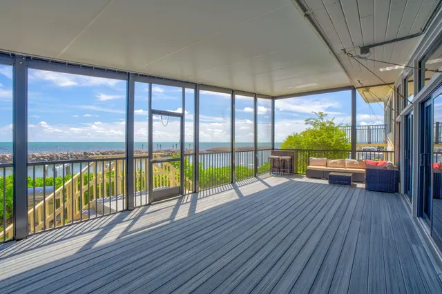 a view of a swimming pool with an outdoor seating