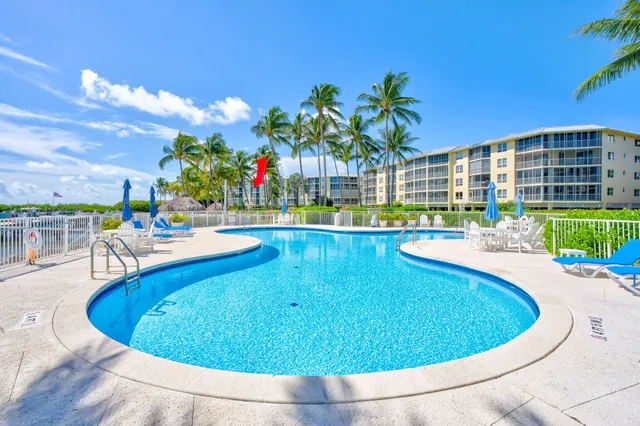 a view of a swimming pool with a chairs