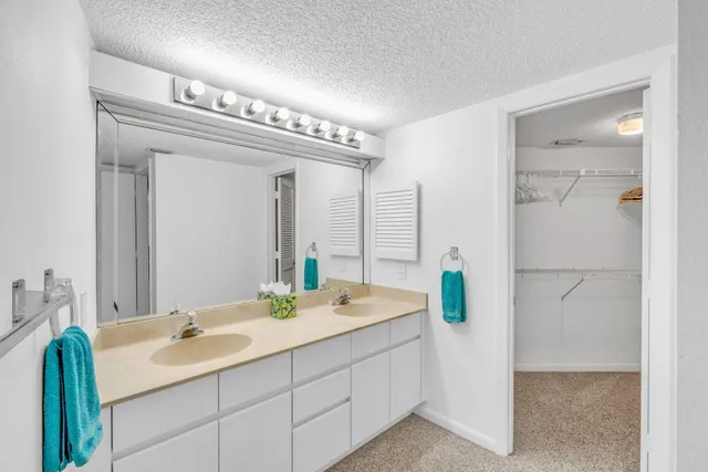 a bathroom with a double vanity sink