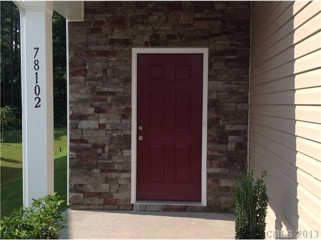 78102 Rillstone Drive, Unit 203 Lancaster, SC 29720 - Photo 2 of 9 a couple of potted plants in front of door