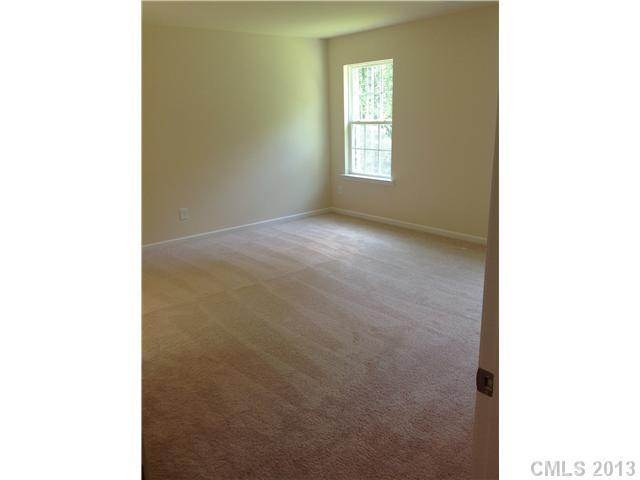 78102 Rillstone Drive, Unit 203 Lancaster, SC 29720 - Photo 8 of 9 a view of an empty room with a window