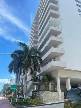 front view of house with palm trees