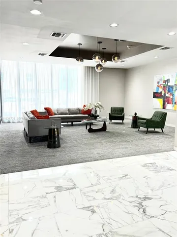 a living room with furniture and window