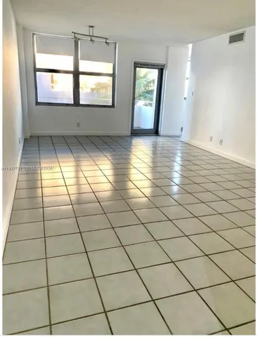 a view of empty room with windows