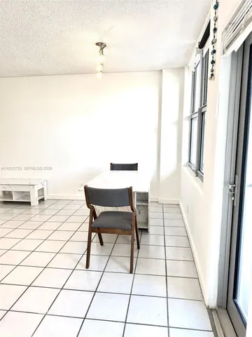 a view of a bathroom with a sink and a mirror