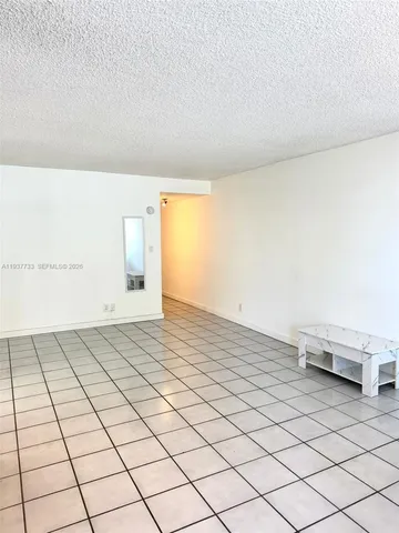 a view of a room with an empty space