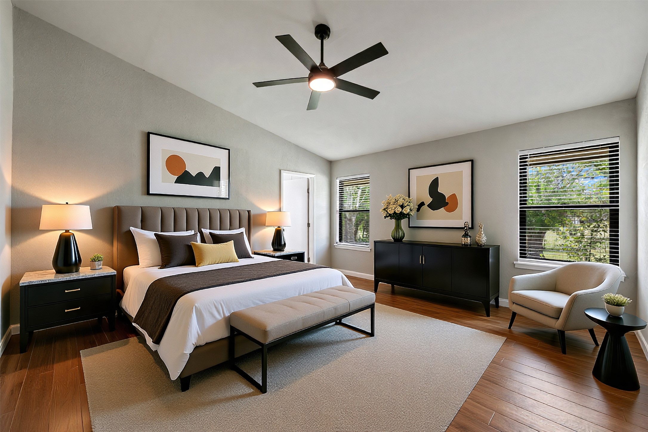 1600 Pin Oak Lane Round Rock, TX 78681 - Photo 23 of 40 Vaulted ceiling bedroom with a contemporary ceiling fan, two large windows, wood-finish flooring, and a neutral wall color