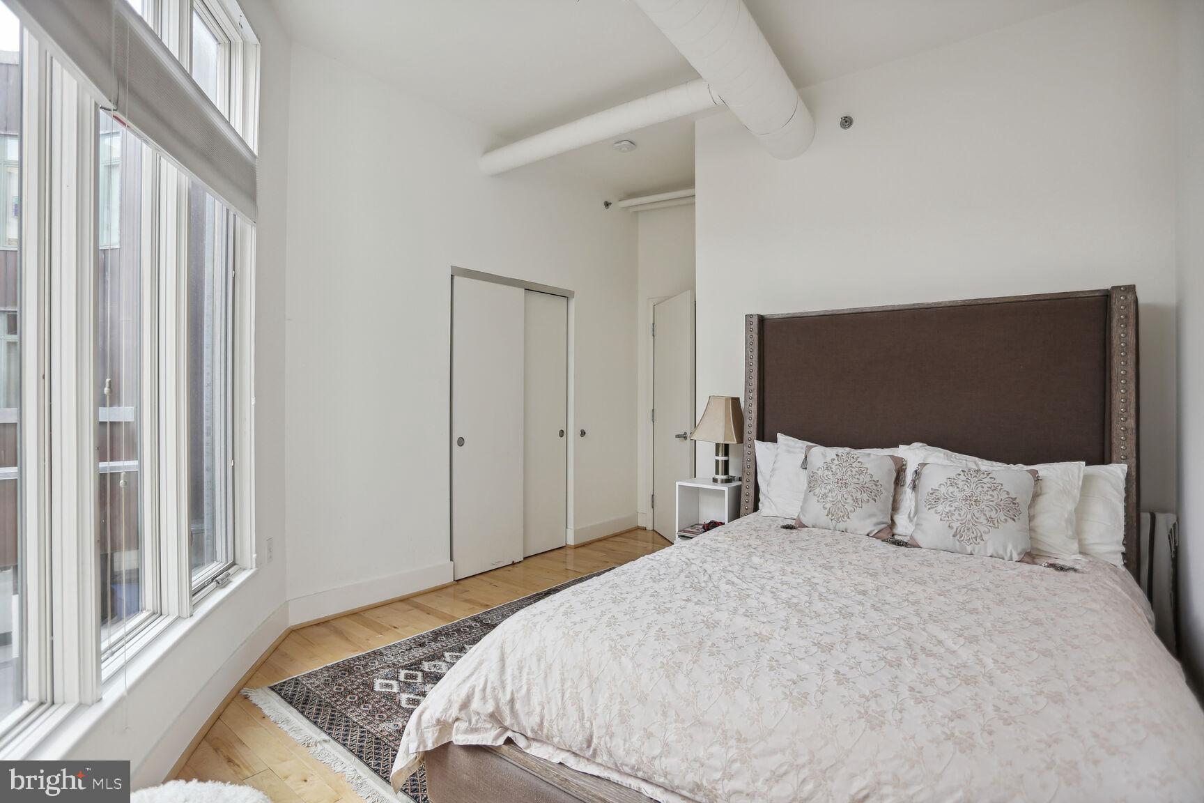 1700 Kalorama Road Northwest, Unit 312 Washington, DC 20009 - Photo 11 of 17 a bedroom with a bed and a window