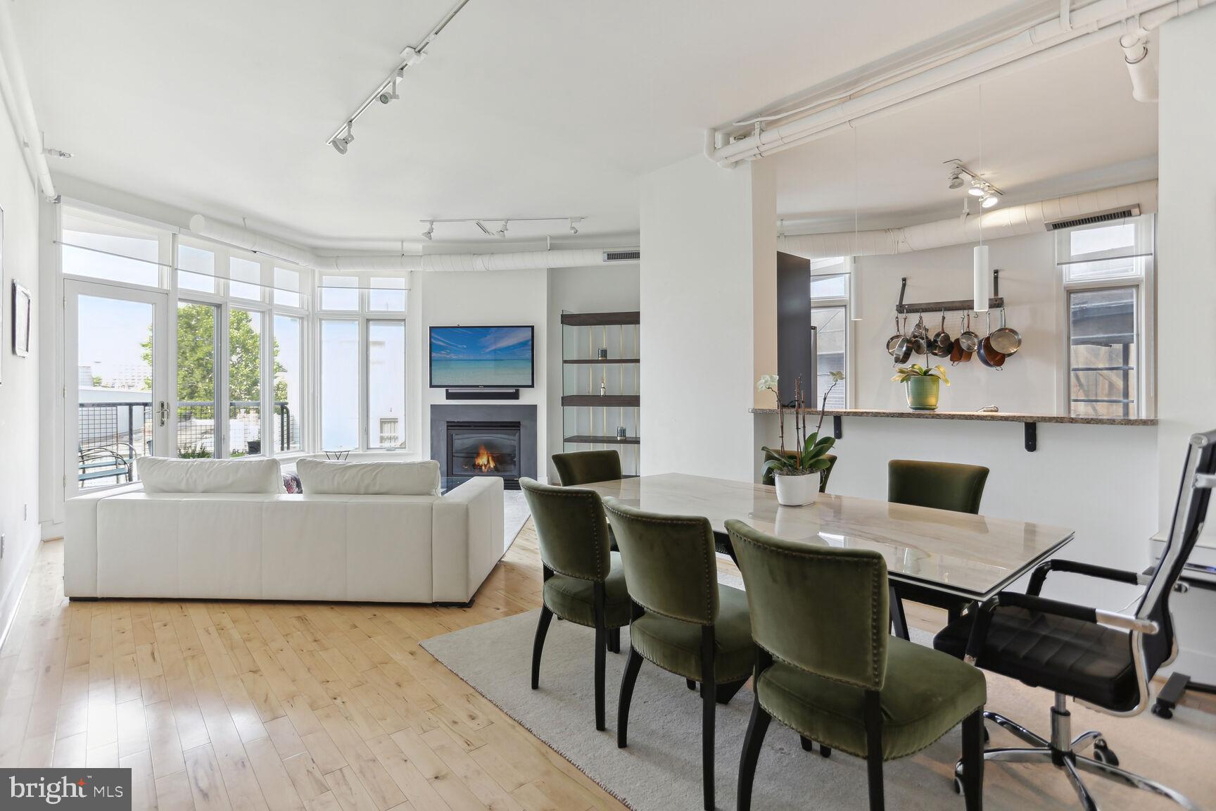 1700 Kalorama Road Northwest, Unit 312 Washington, DC 20009 - Photo 3 of 17 a view of a dining room with furniture window and wooden floor