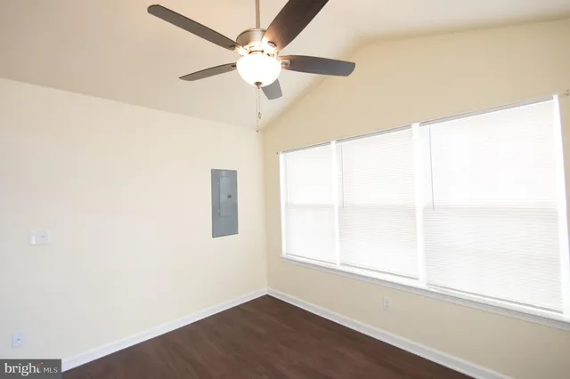 a view of a kitchen with a sink and a ceiling fan